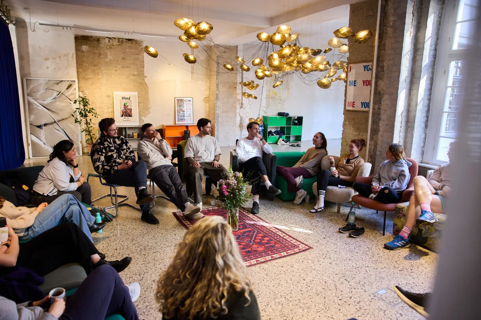 A programme group in a session together, relaxed.